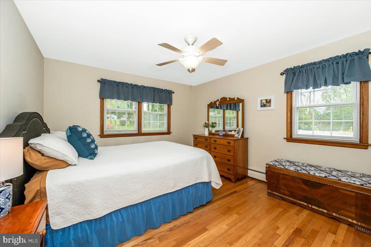 22019 Mohawk Drive Smithsburg, MD 21783 - Photo 24 of 60 a bedroom with a bed and wooden floor