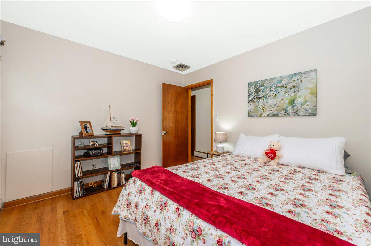 22019 Mohawk Drive Smithsburg, MD 21783 - Photo 30 of 60 a bedroom with a bed and a cabinets