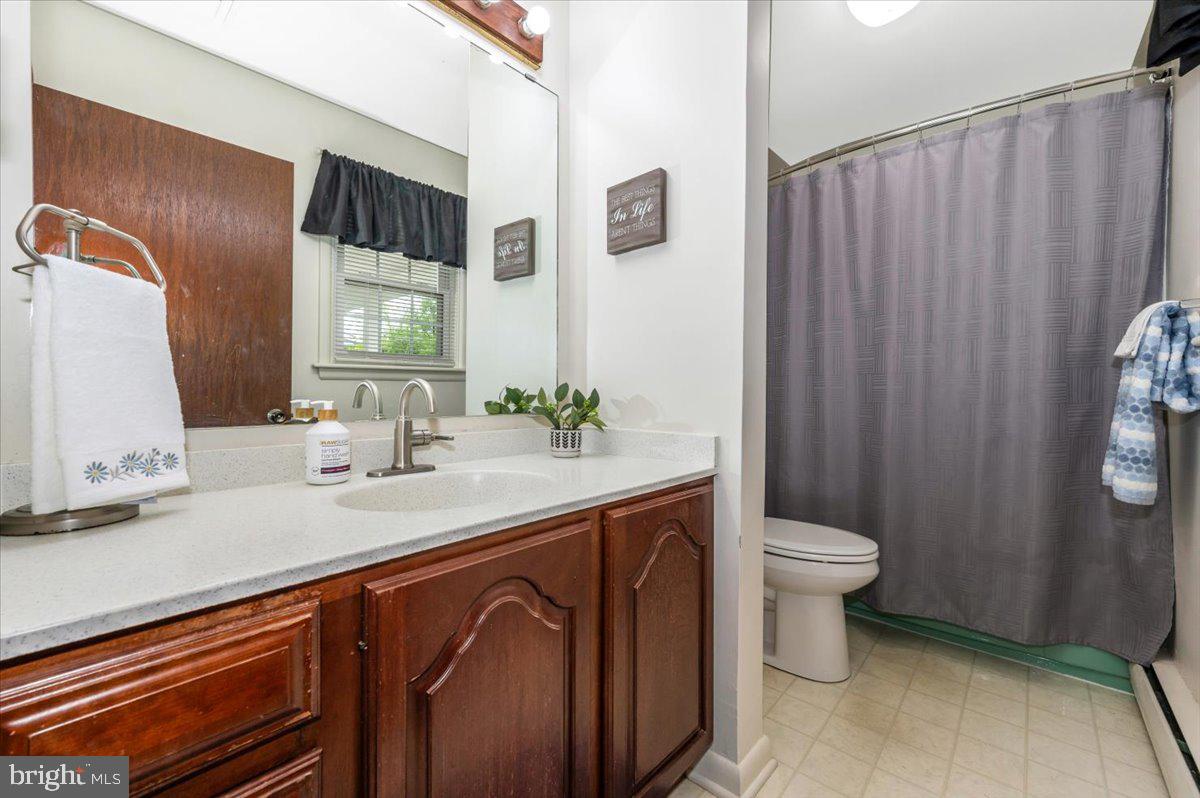 22019 Mohawk Drive Smithsburg, MD 21783 - Photo 33 of 60 a bathroom with a sink a toilet and mirror