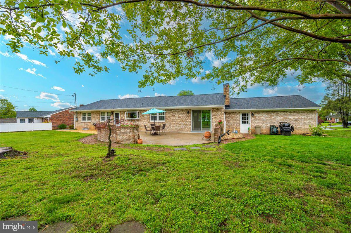 22019 Mohawk Drive Smithsburg, MD 21783 - Photo 47 of 60 a front view of a house with a garden and trees