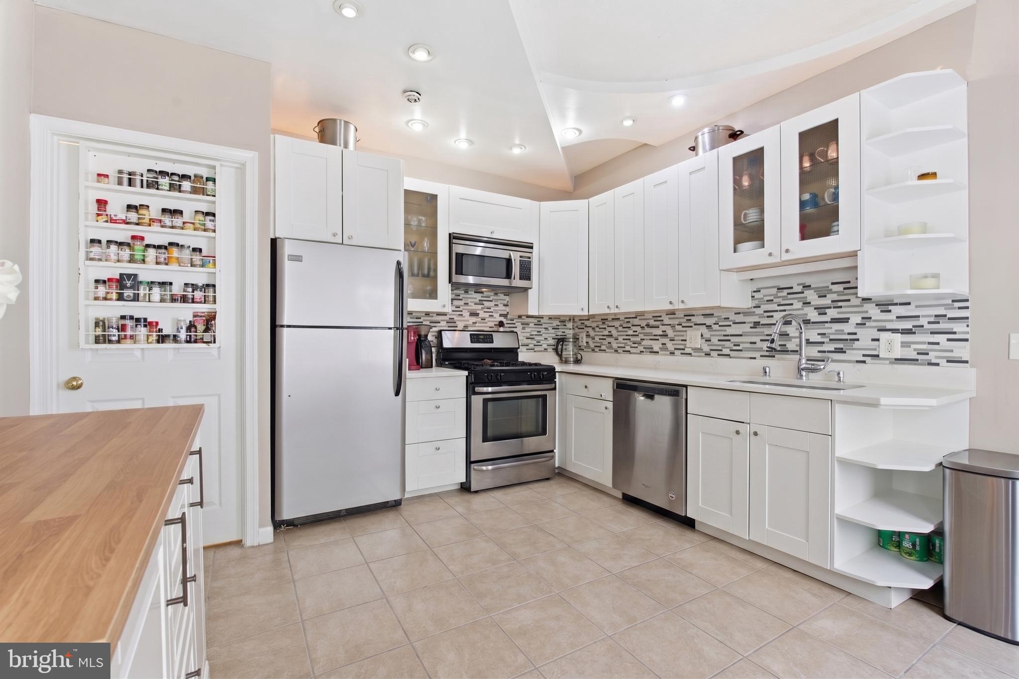 116 West Clement Street Baltimore, MD 21230 - Photo 11 of 32 a kitchen with a refrigerator and a sink