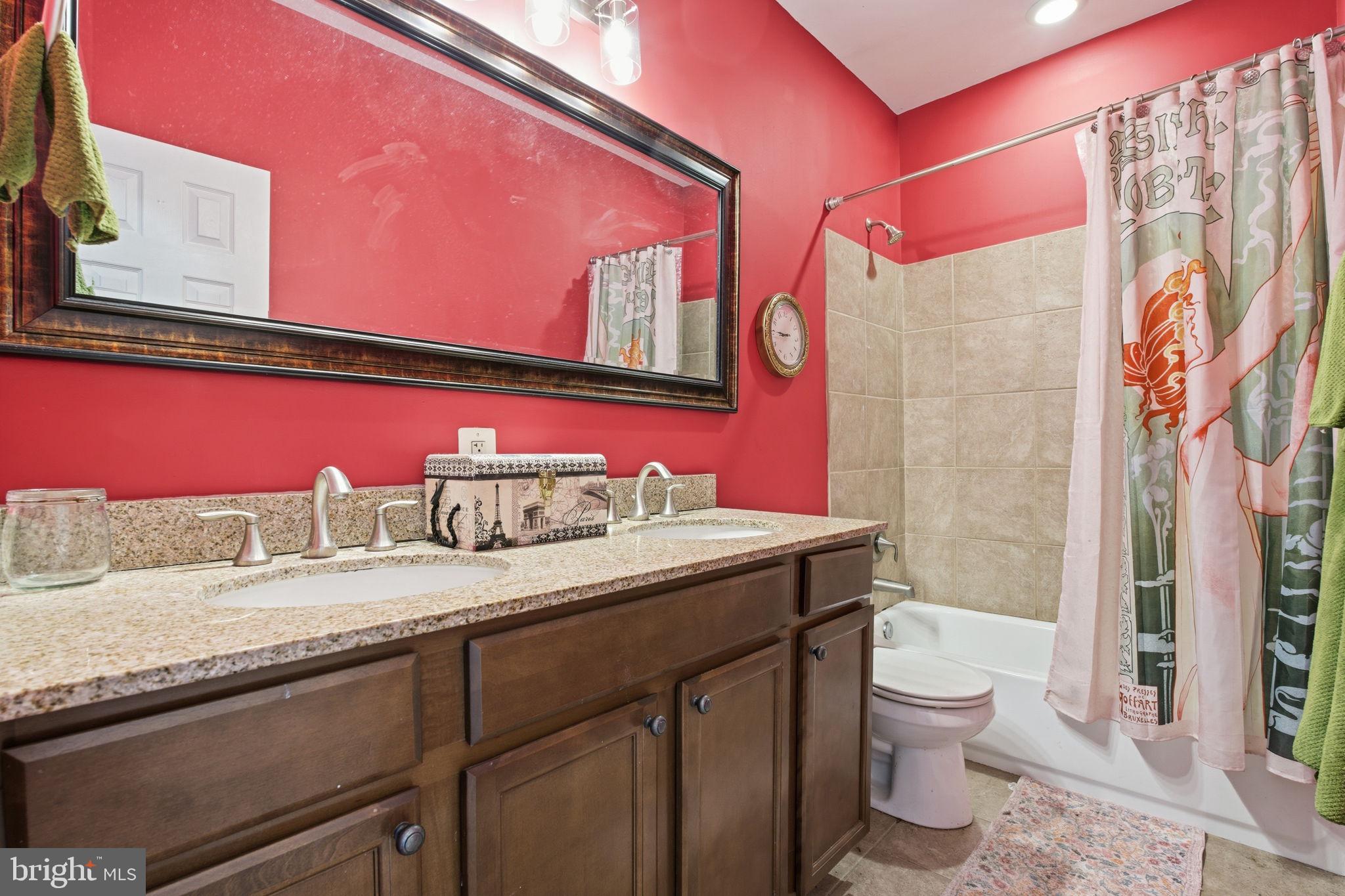 116 West Clement Street Baltimore, MD 21230 - Photo 28 of 32 a bathroom with a granite countertop sink and a mirror