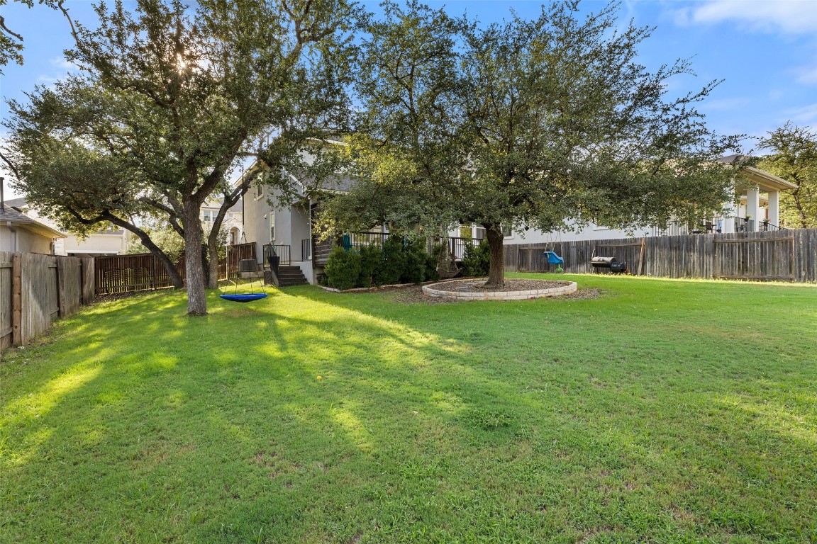 5217 Del Dios Way Austin, TX 78738 - Photo 1 of 1 a view of a house with a big yard and large trees