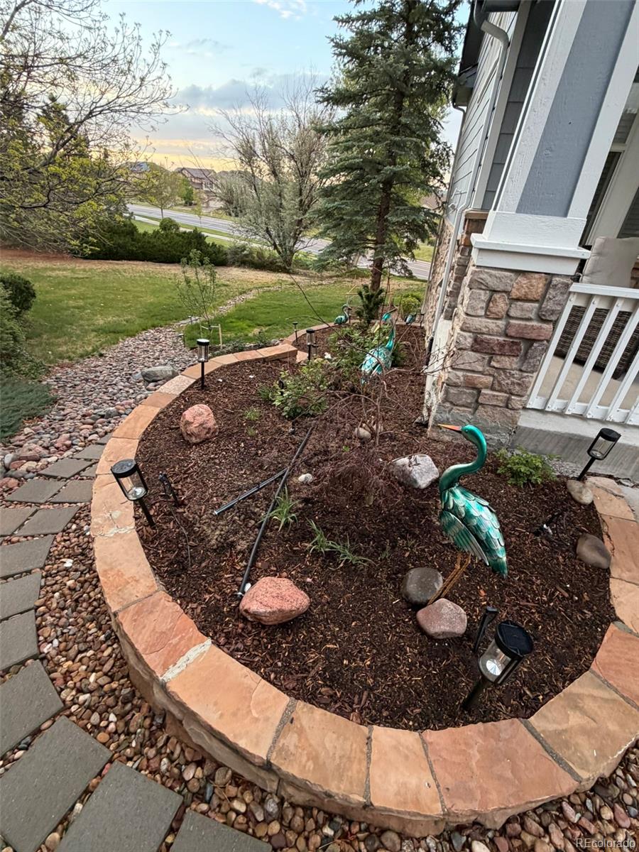 7242 South Rome Street Aurora, CO 80016 - Photo 29 of 33 a view of a backyard with water fountain