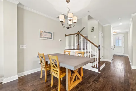 a view of entryway with wooden floor and stairs