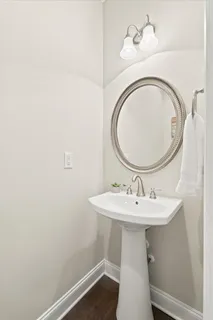a bathroom with a sink a mirror and vanity