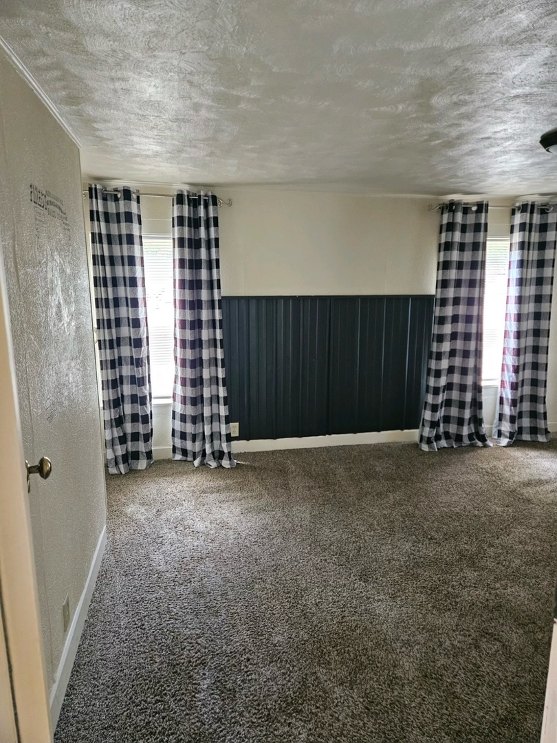 416 Madison Avenue Dixon, IL 61021 - Photo 12 of 34 a view of an empty room with a window