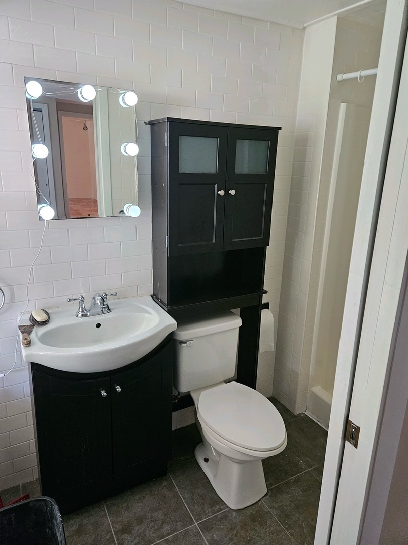 416 Madison Avenue Dixon, IL 61021 - Photo 22 of 34 a bathroom with a sink toilet and mirror