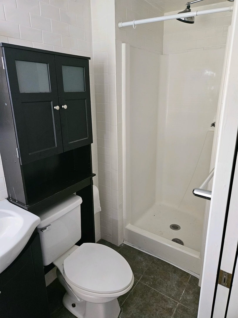 416 Madison Avenue Dixon, IL 61021 - Photo 23 of 34 a bathroom with a toilet and a shower