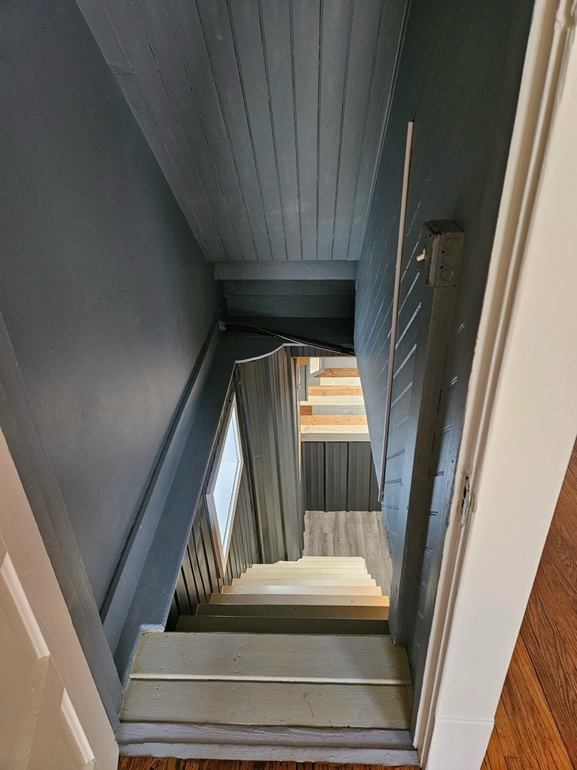 416 Madison Avenue Dixon, IL 61021 - Photo 24 of 34 a view of staircase with wooden floor and door