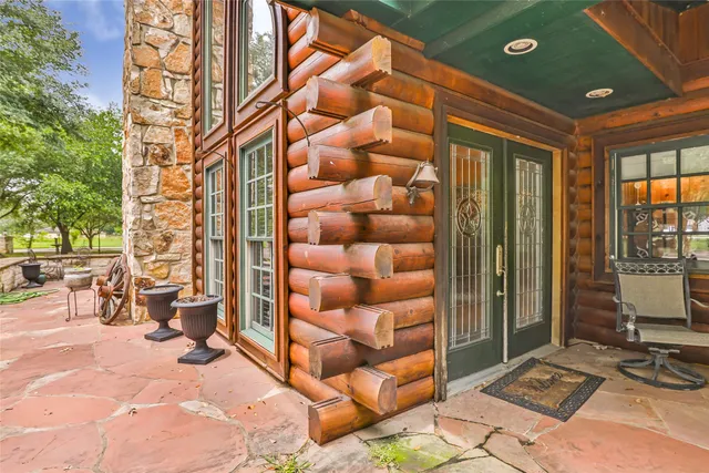 a view of a backyard with sitting area