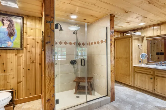 a bathroom with a shower and a sink