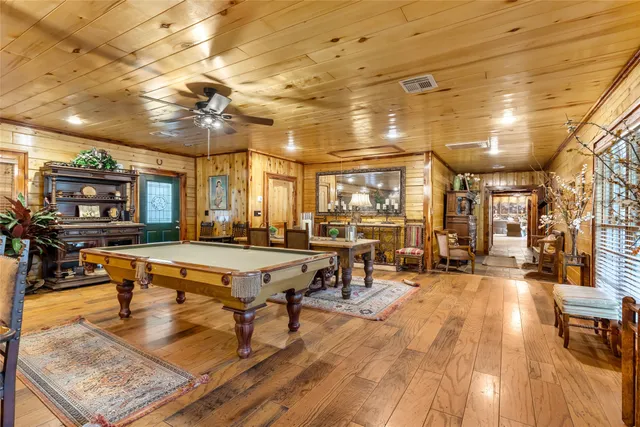 a living room with lots of furniture and a table