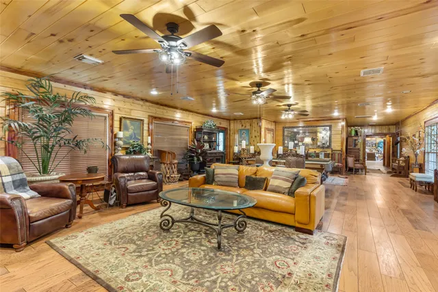 a living room with lots of furniture and a rug