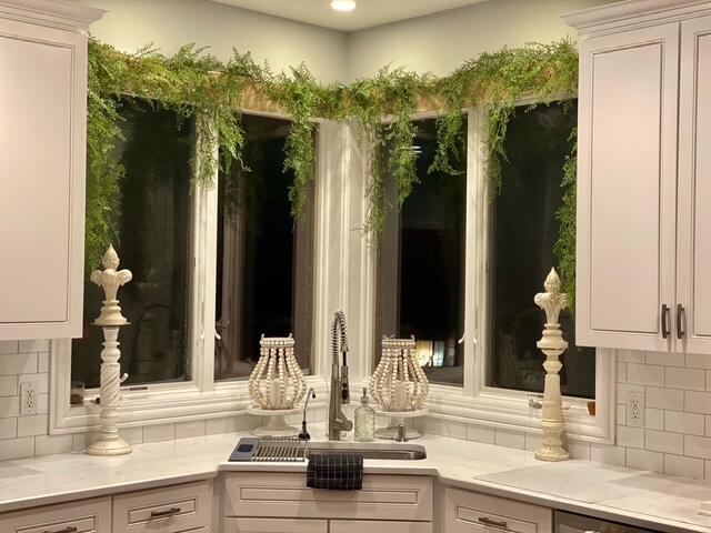 9261 Ruth Court St. John, IN 46373 - Photo 8 of 48 a kitchen with a sink and a large mirror