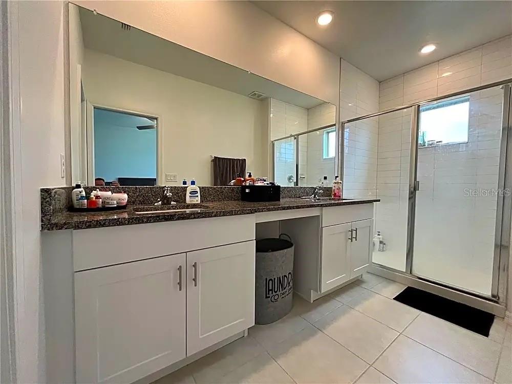 31751 Blue Passing Loop Wesley Chapel, FL 33545 - Photo 10 of 18 a kitchen with a sink and cabinets