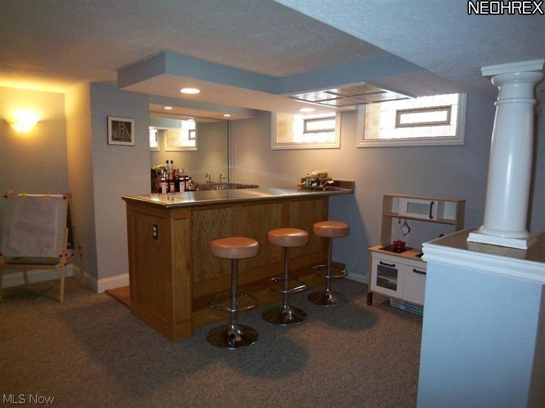 3165 Coleridge Road Cleveland, OH 44118 - Photo 18 of 23 Glass block windows throughout the basement, wet bar with beverage refrigerator, microwave and full bath complete this recreation room for the entire family.