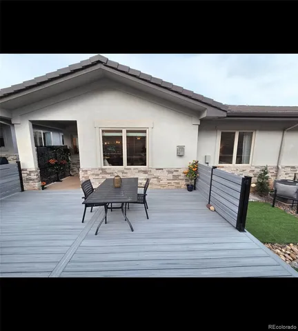 a large kitchen with kitchen island a sink table and chairs