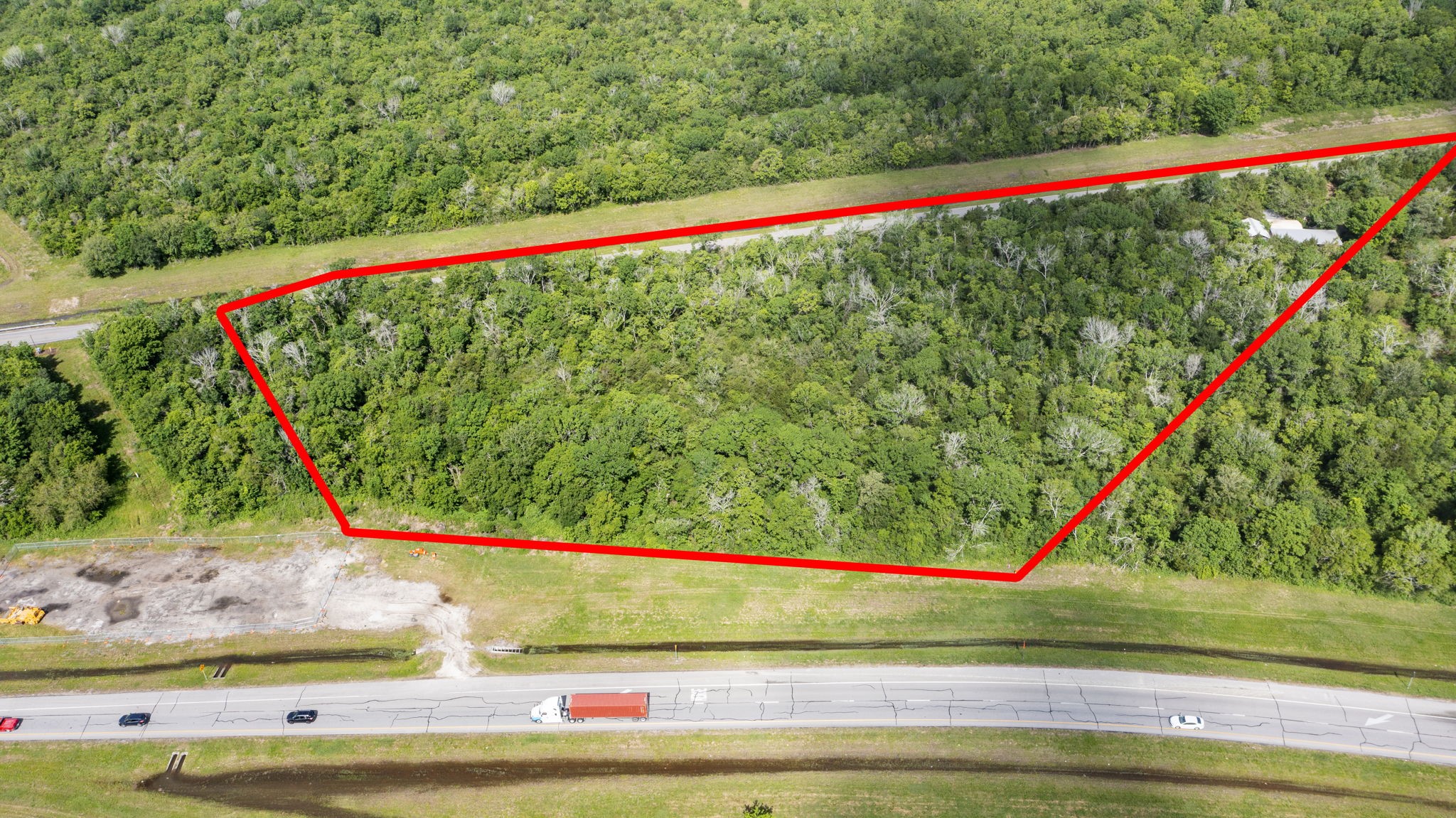 2 South Johnson Street Alvin, TX 77511 - Photo 3 of 13 a view of a yard with potted plants and wooden fence