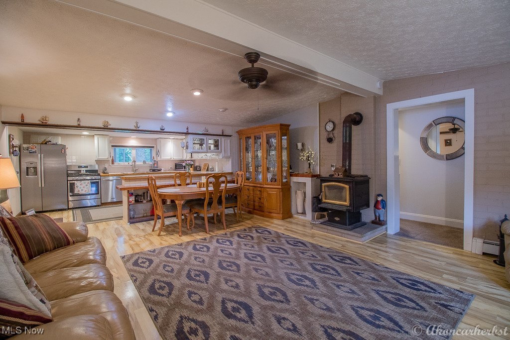 1667 Red Bird Road Madison, OH 44057 - Photo 28 of 44 Great room is open to the kitchen with a low breakfast bar. Door leads to the bathroom and two bedrooms