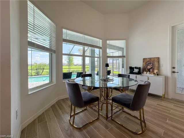 a dining room with furniture window wooden floor
