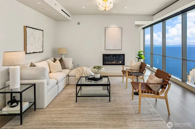 a living room with furniture and a lamp