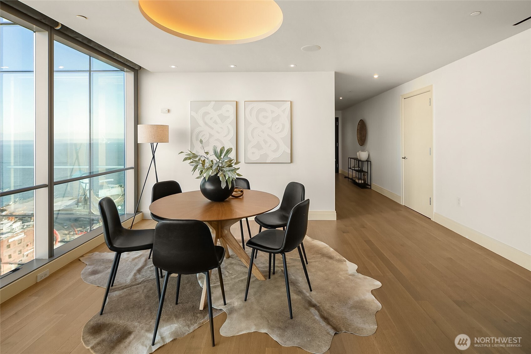 99 Union Street, Unit 1401 Seattle, WA 98101 - Photo 6 of 17 a view of a dining room with furniture and wooden floor