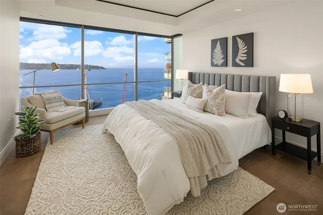 a bed sitting in a bedroom next to a window