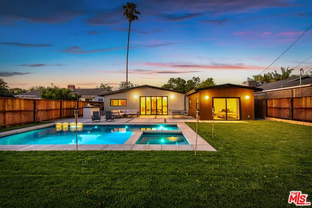 a view of a house with a swimming pool