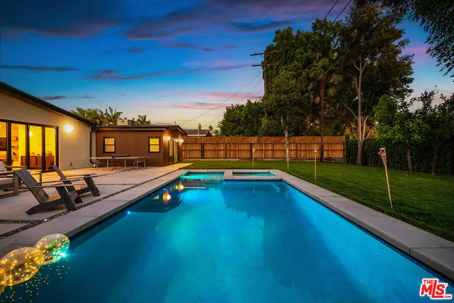 a view of swimming pool with a yard
