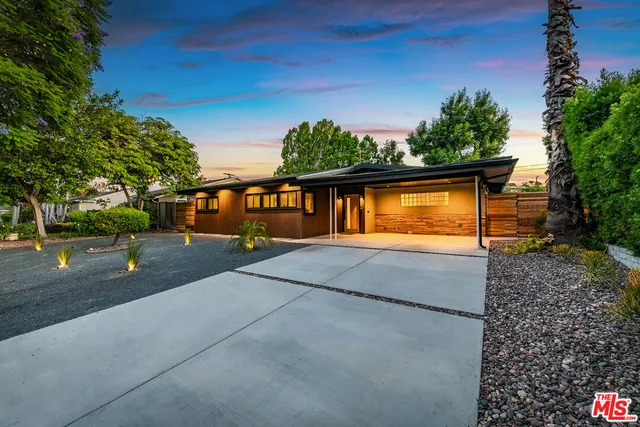 a view of a swimming pool with a yard