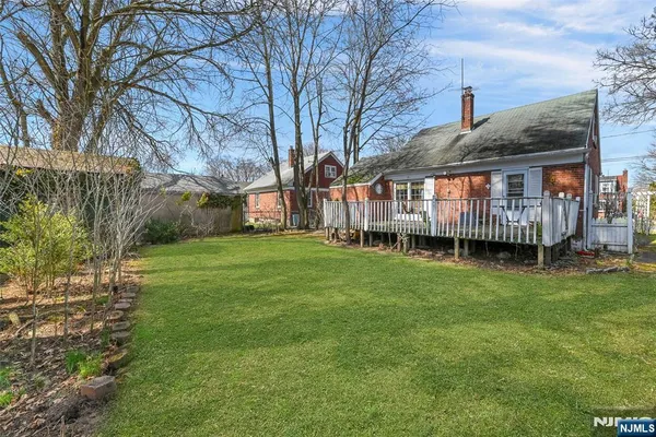 a backyard of a house with yard and trampoline