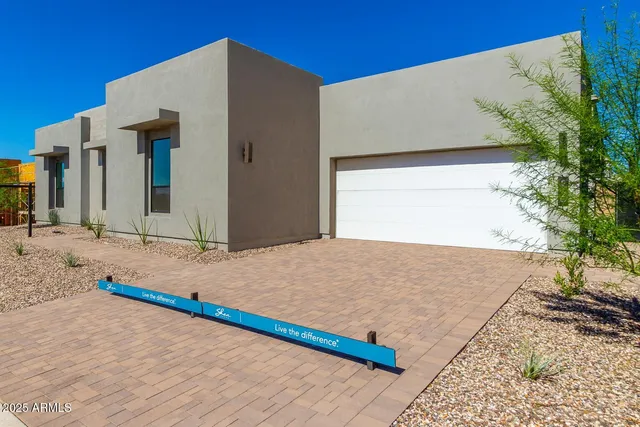 a bedroom with a bed and a potted plant