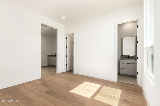 a view of a bathroom with a sink and a mirror
