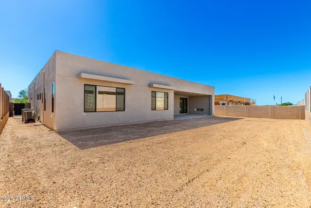 a view of a house with a snow in the yard