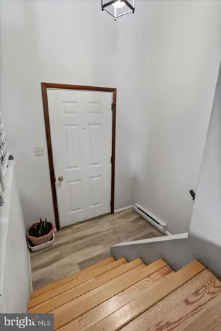 a bedroom with furniture and a potted plant