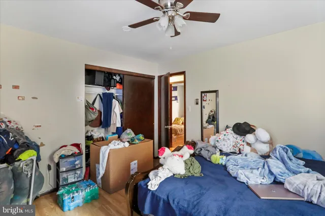a bedroom with bed and a window