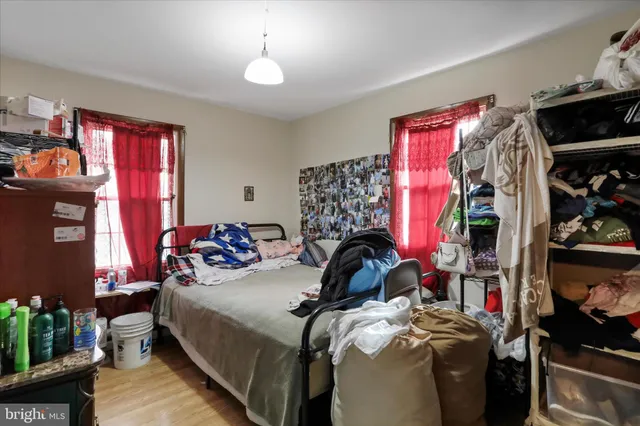 a bedroom with bed and a window