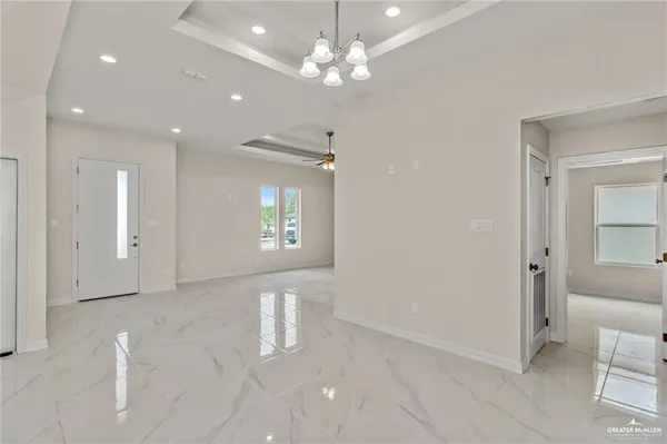 a view of an empty room with a bathroom