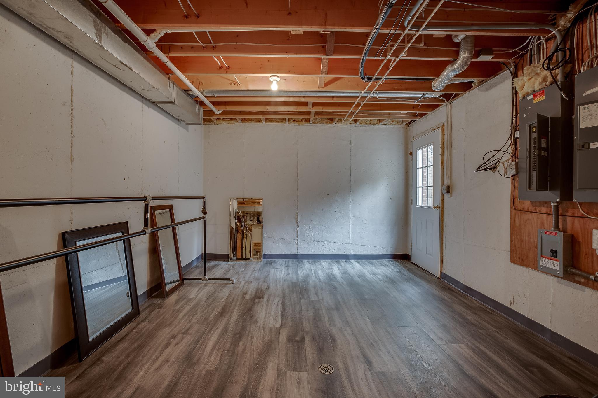6504 Griffith Road Gaithersburg, MD 20882 - Photo 50 of 73 Basement with new LVP flooring and side exit