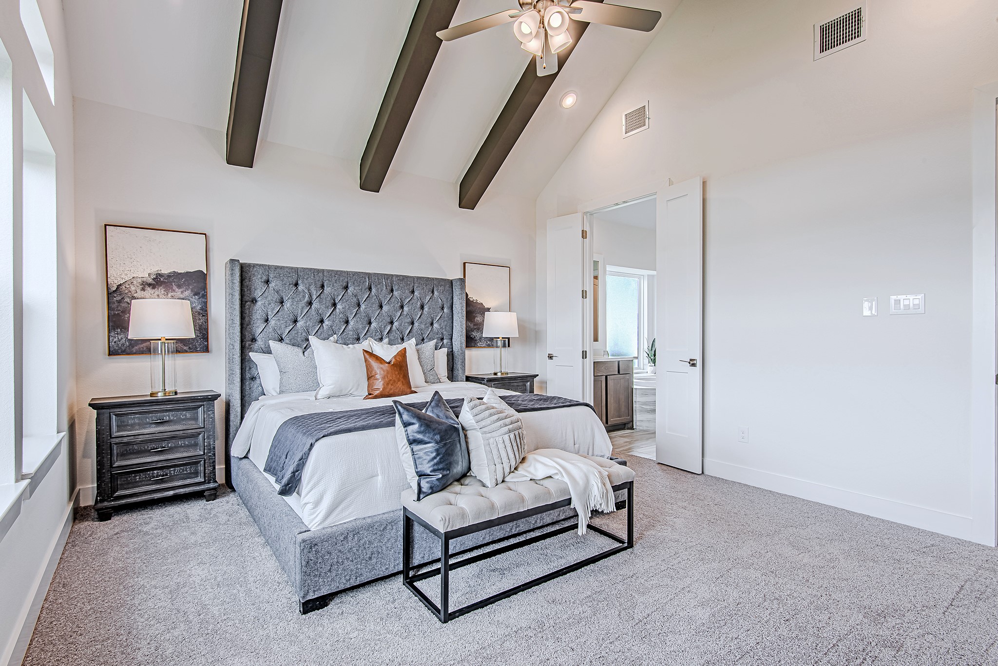 187 Peninsula Point Drive Montgomery, TX 77356 - Photo 13 of 31 A second look at the serene primary suite showcases its generous size, architectural details, and direct access to the spa-like bath beyond double doors.