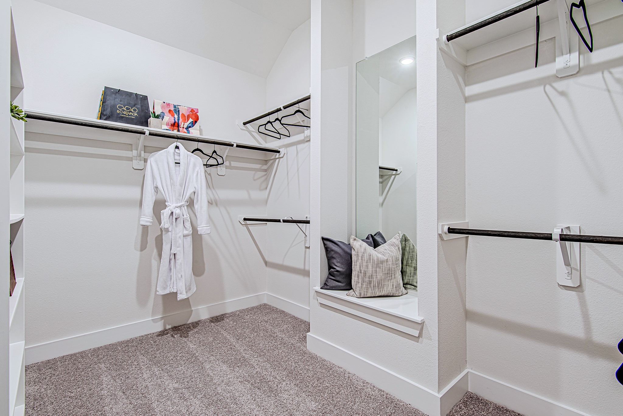 187 Peninsula Point Drive Montgomery, TX 77356 - Photo 17 of 31 More than just a walk-in—this is a walk-in experience. Designed with purpose and a hint of flair, the spacious layout includes a full-length mirror, open shelving, and a cozy built-in bench for slipping off heels or contemplating life’s next outfit.