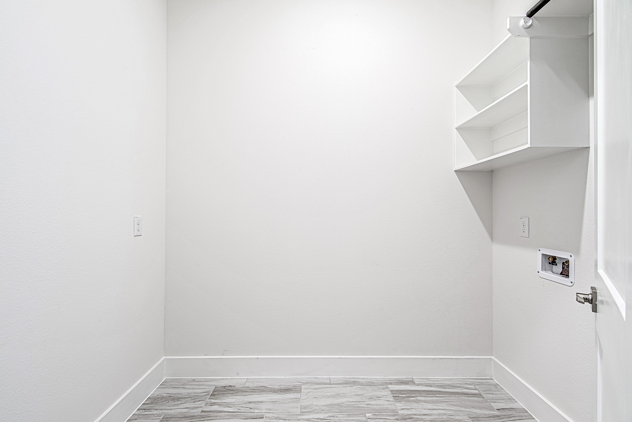 187 Peninsula Point Drive Montgomery, TX 77356 - Photo 20 of 31 The dedicated laundry room with built-in shelving and space to move—designed to keep your household running like a well-oiled machine.