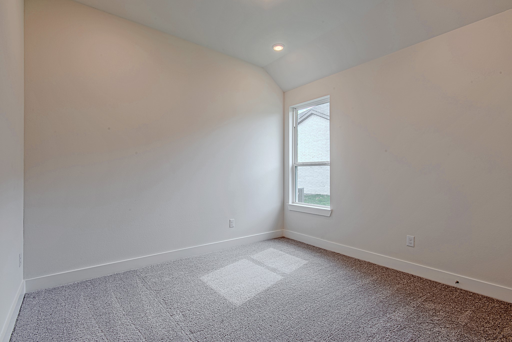 187 Peninsula Point Drive Montgomery, TX 77356 - Photo 21 of 31 Another spacious secondary bedroom, brightened by a tall window and elevated ceilings—comfortably versatile and ready for your touch.