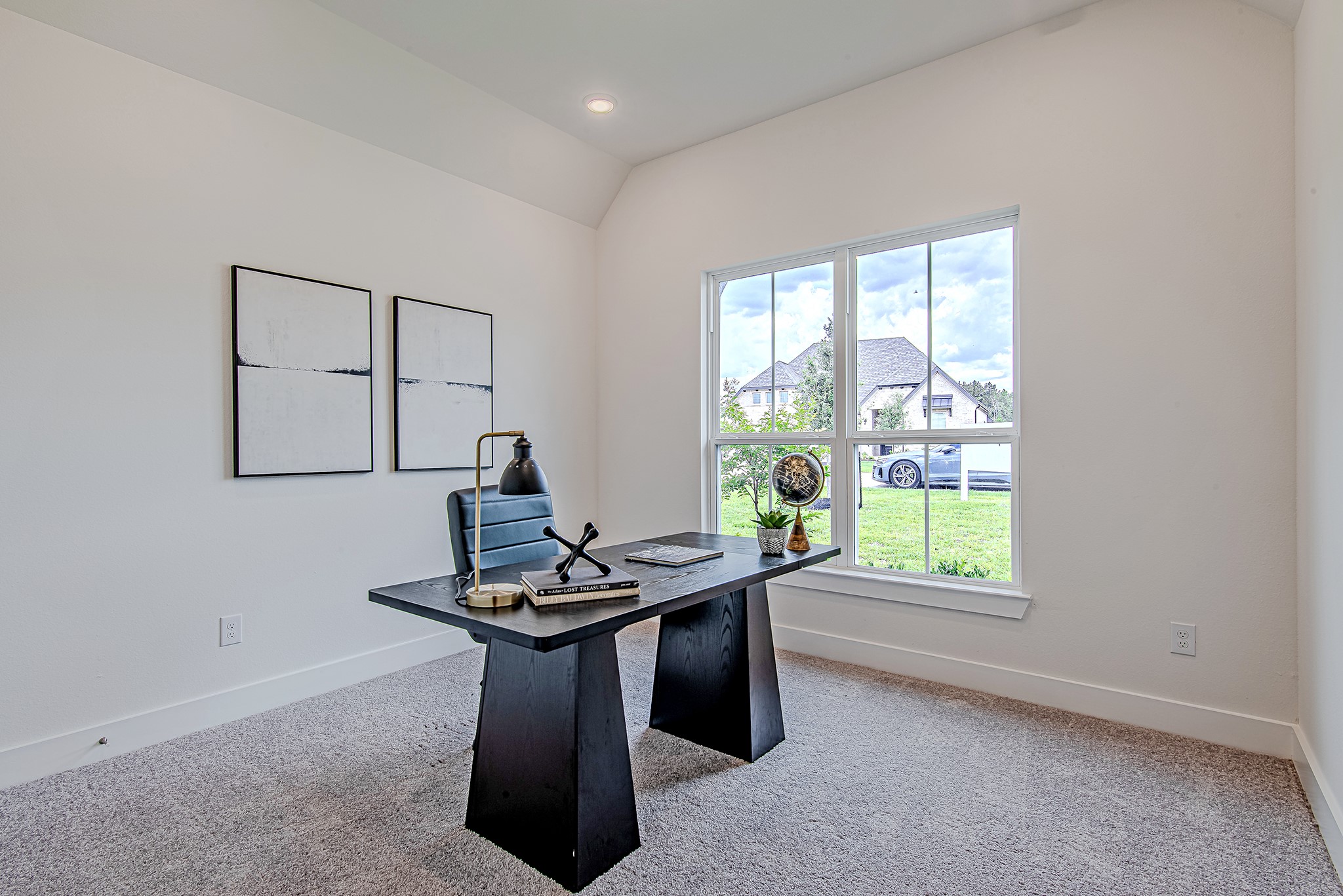 187 Peninsula Point Drive Montgomery, TX 77356 - Photo 23 of 31 Bathed in natural light with a view of the front lawn, this versatile space is ideal as a home office, study, or creative retreat. The elevated ceiling adds a sense of airiness, while the neutral palette makes it easy to make your own.