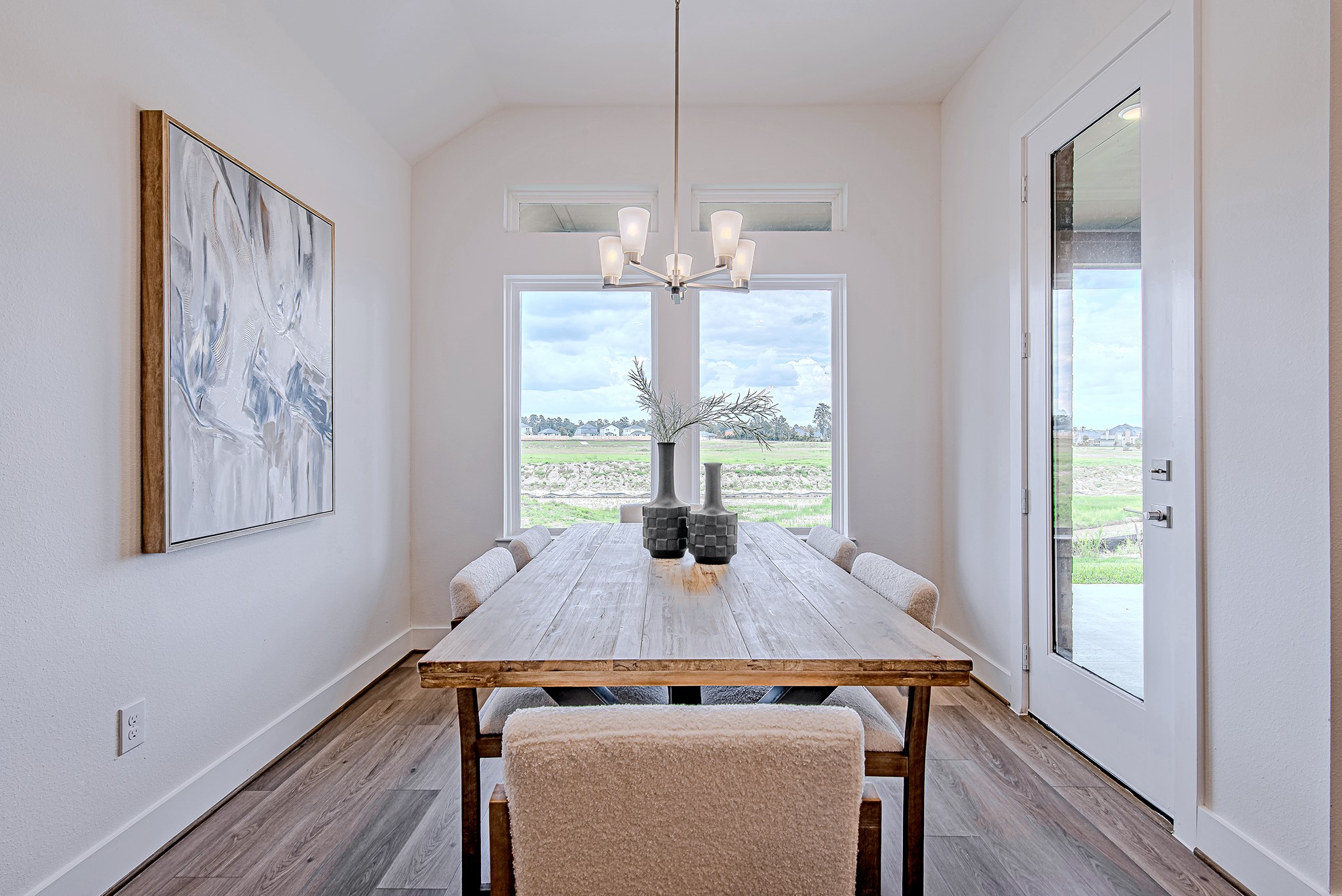 187 Peninsula Point Drive Montgomery, TX 77356 - Photo 10 of 31 The dining area is sun-drenched and ready for everything from pancakes to prosecco. Anchored by oversized windows and easy access to the patio, it’s a bright spot in more ways than one.
