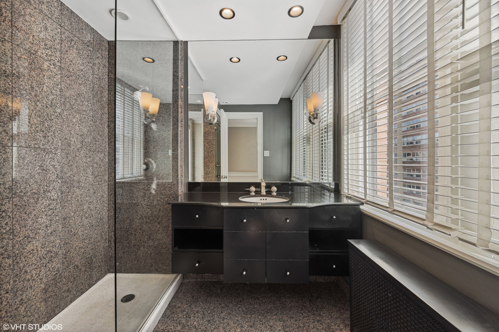 3100 North Sheridan Road, Unit 4D Chicago, IL 60657 - Photo 12 of 21 a bathroom with a double vanity sink and mirror with bathtub