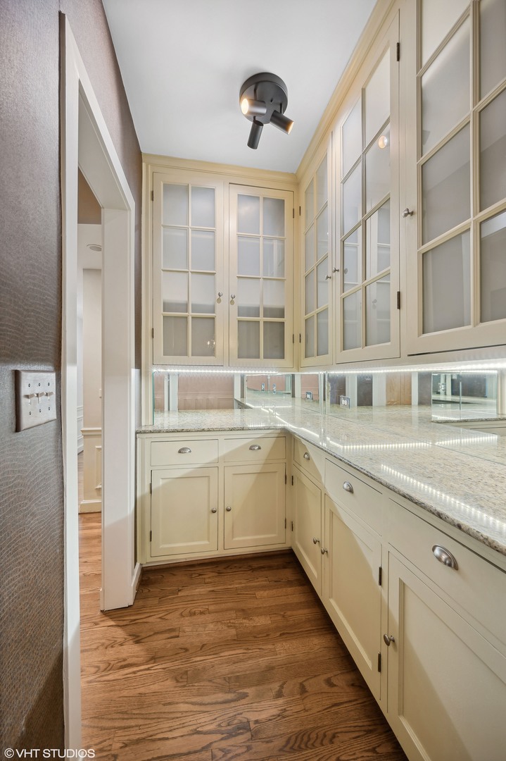 3100 North Sheridan Road, Unit 4D Chicago, IL 60657 - Photo 15 of 21 a large white kitchen with granite countertop a stove and a sink