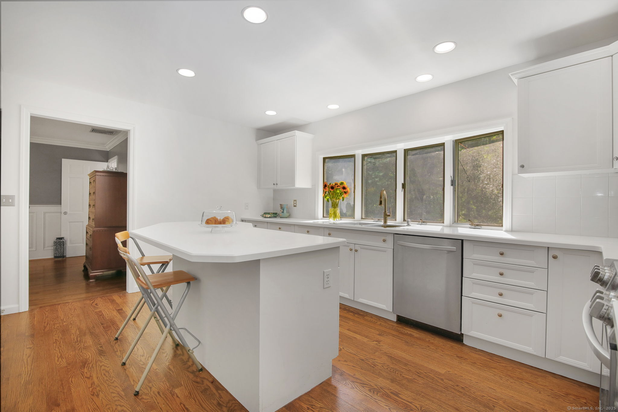 63 Pipers Hill Road Wilton, CT 06897 - Photo 12 of 37 a kitchen with a sink and cabinets