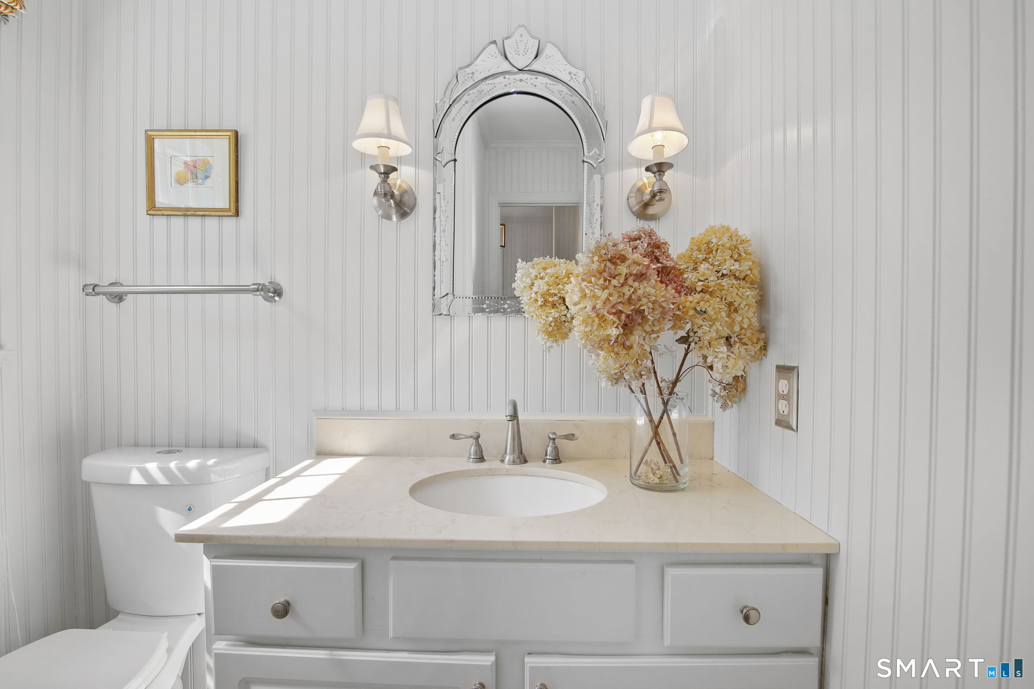 63 Pipers Hill Road Wilton, CT 06897 - Photo 17 of 37 a bathroom with a sink and a mirror